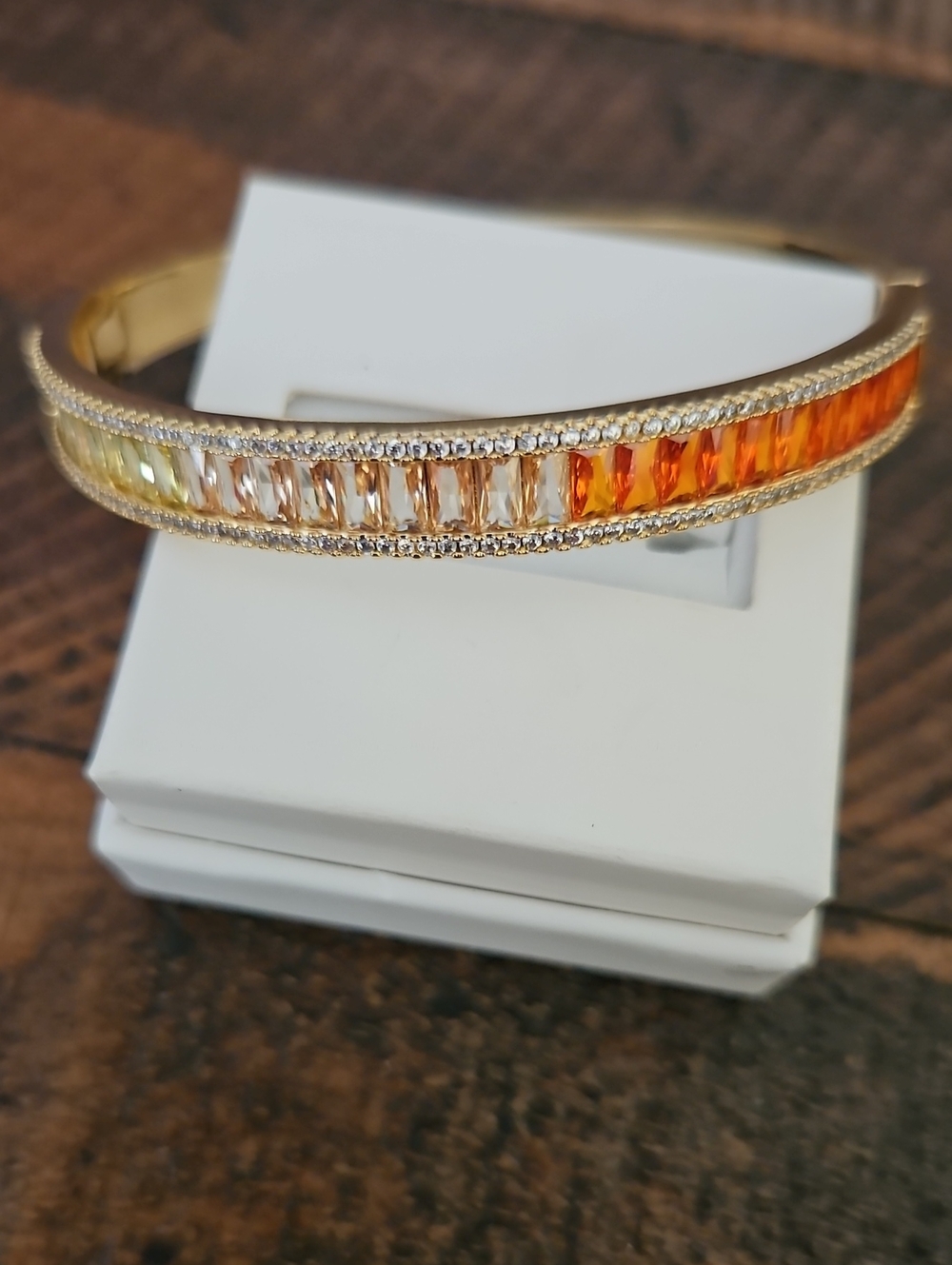 Gold Bangle Bracelet with Orange to Champagne Baguette Stones
